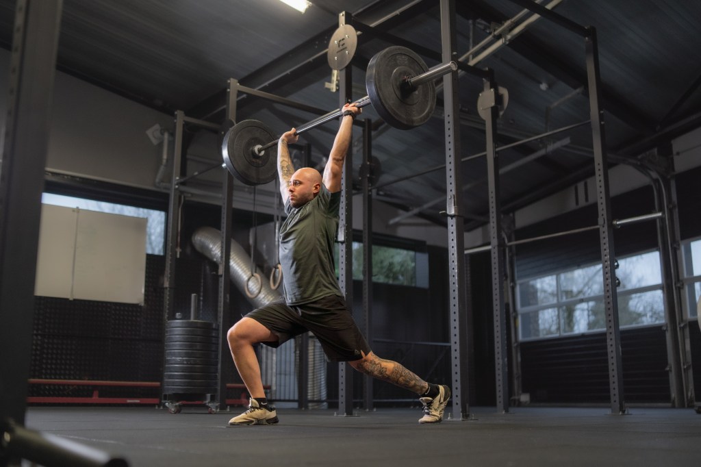 Powerful weightlifting moment captured, emphasizing strength and technique. At Cluster Zuid | Driven By Sports.